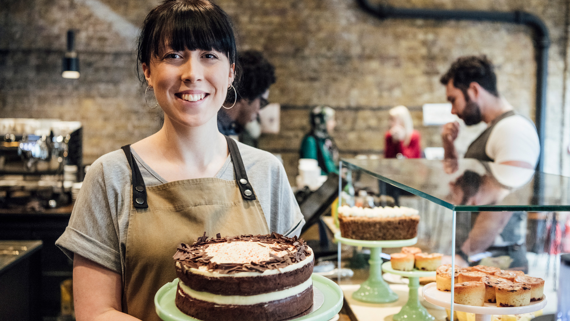 Woman smiling at work after finding a job with anxiety