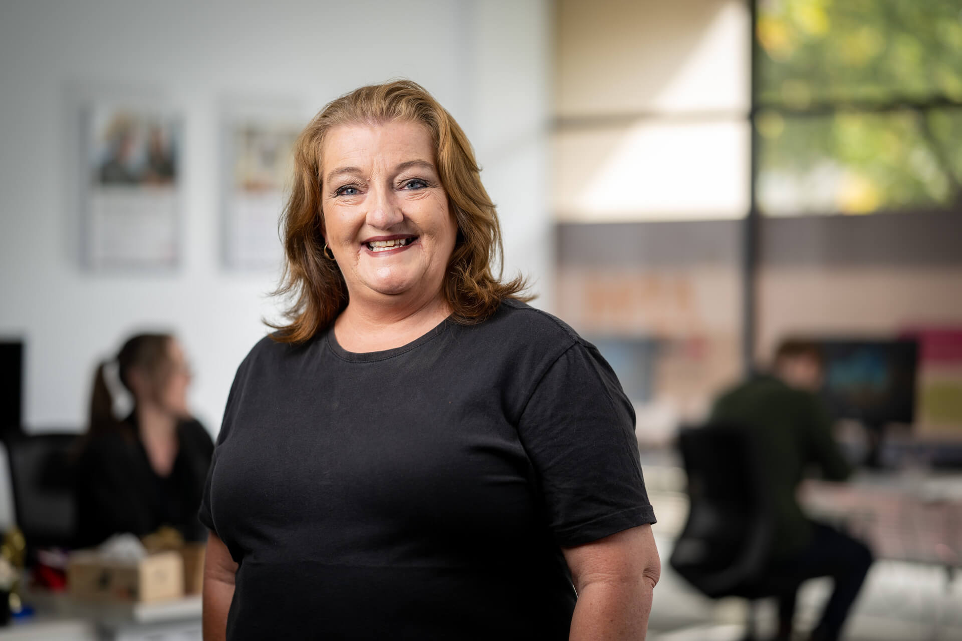 DES participant Robyn smiles with confidence after support from APM