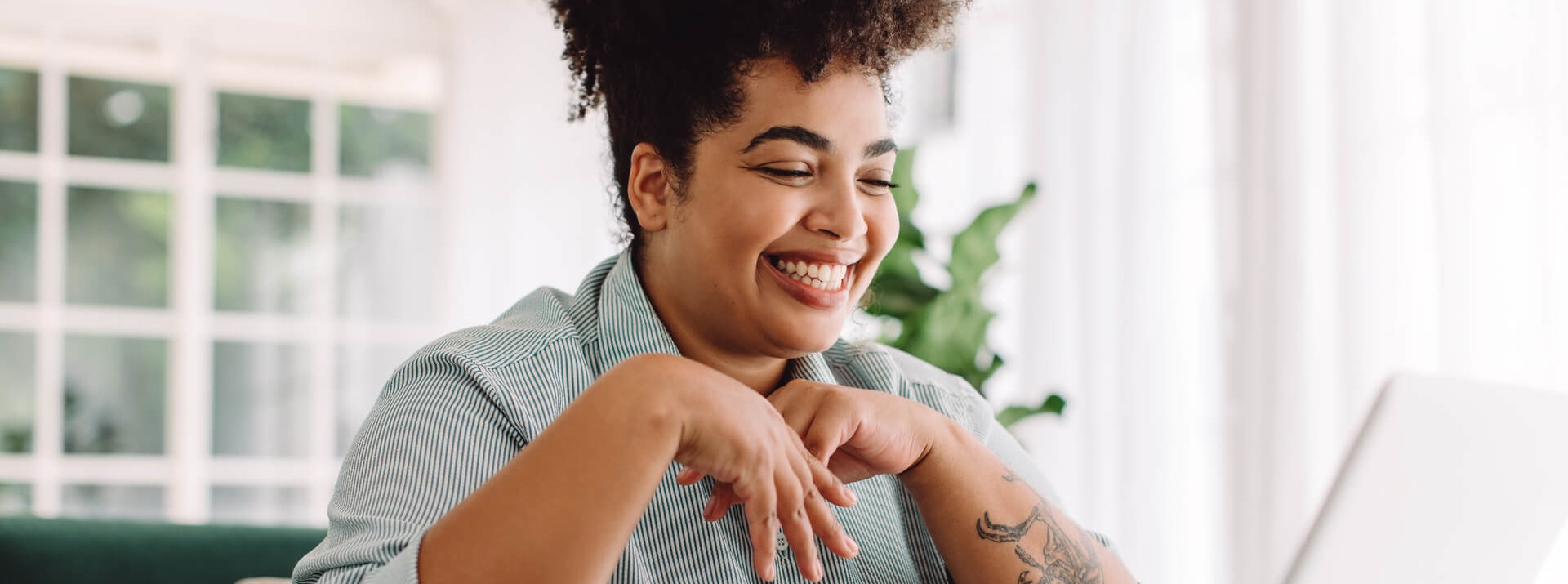 Woman happy that she is receiving support to find work while living with Bipolar Disorder
