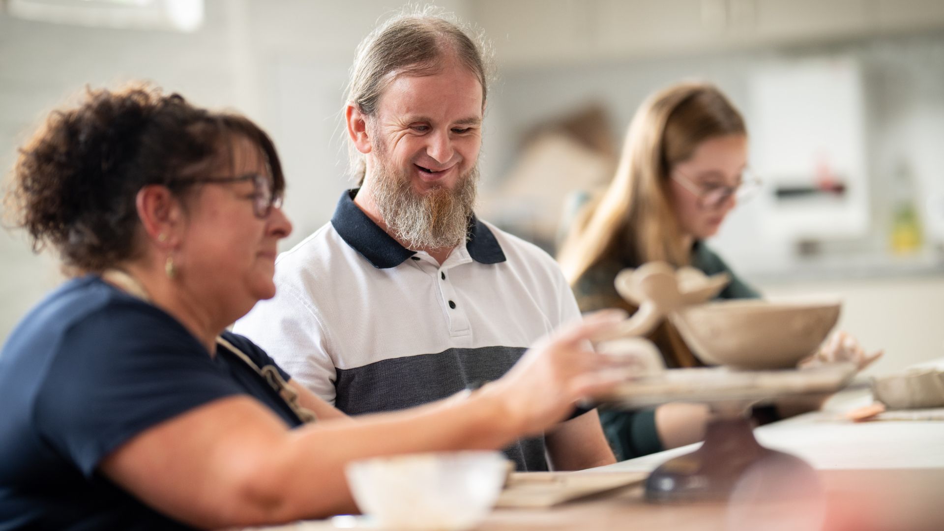 Ben sat and teaching art student Danielle