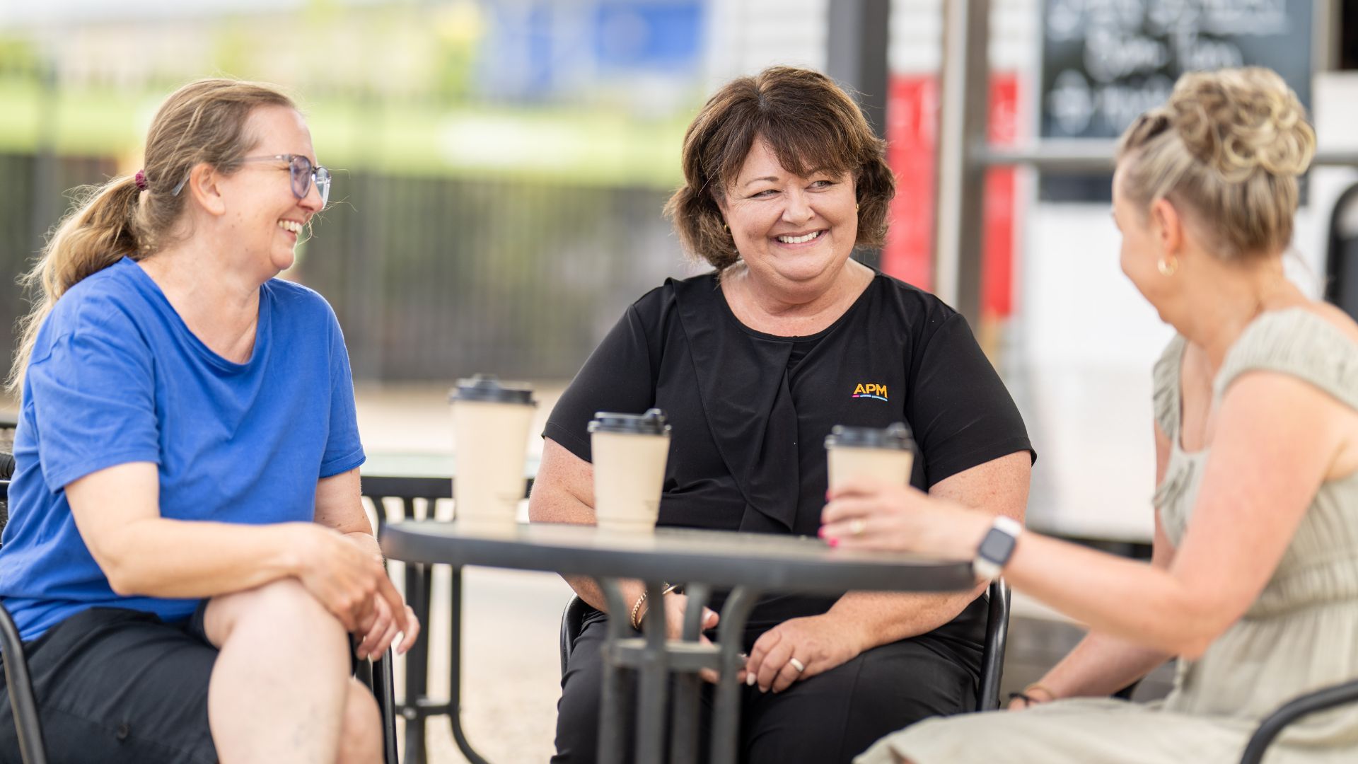 Megan, Janelle from APM and Lisa sat at a table together