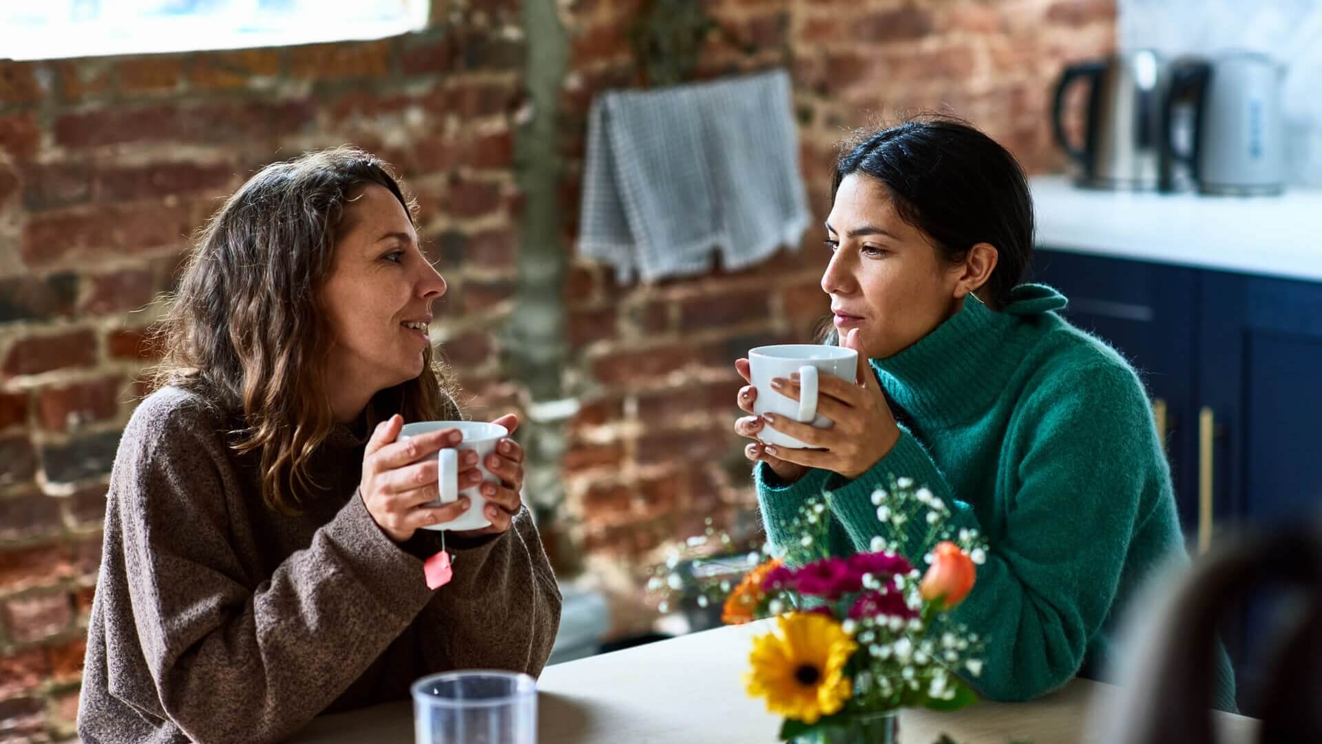 Two women having a cup of coffee in a cafe